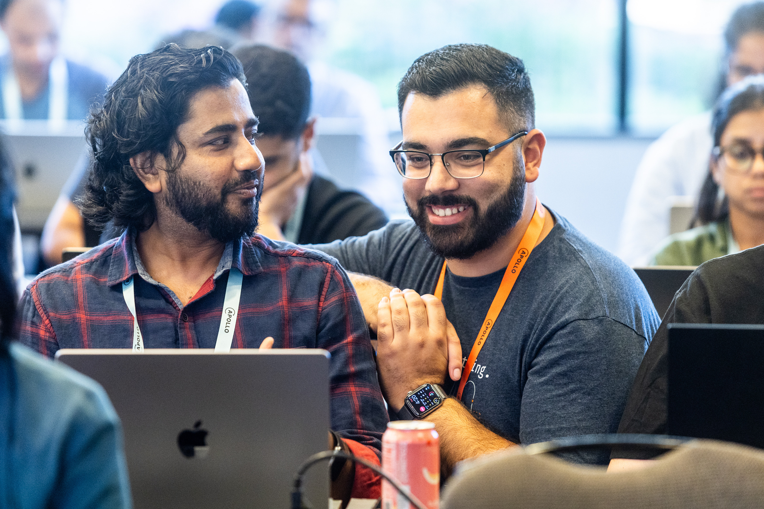 Two attendees in conversation at a Summit breakout.